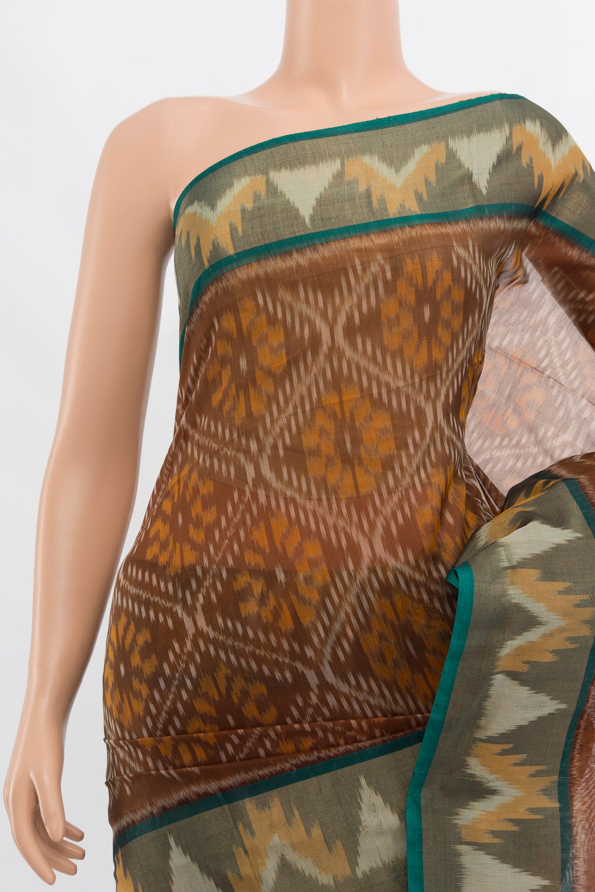Border image of Brown Kora Cotton Saree with Ikat Print on the body and Silk Border. 