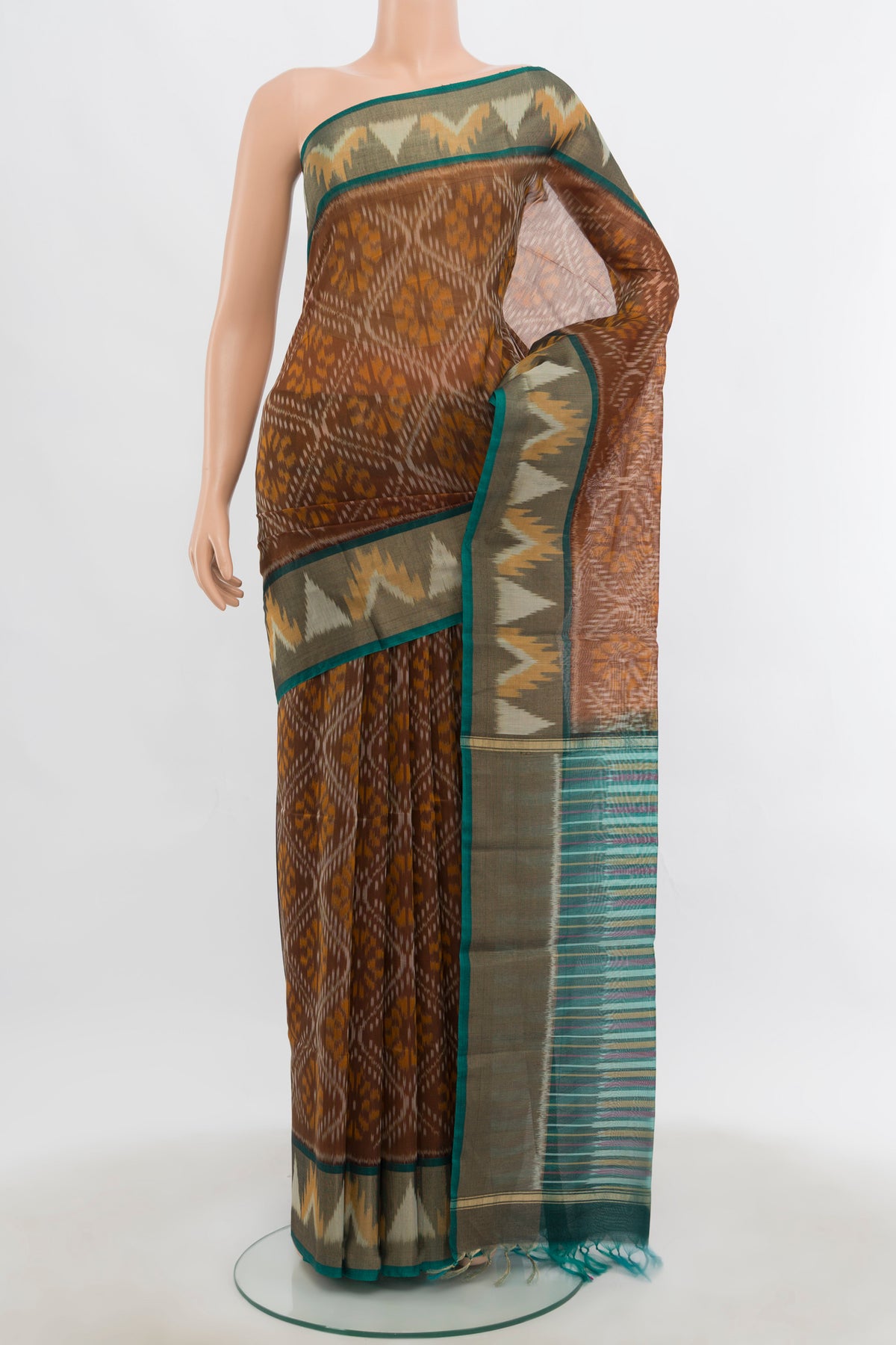 Brown Kora Cotton Saree with Ikat Print on the body and Silk Border.  displayed on a mannequin