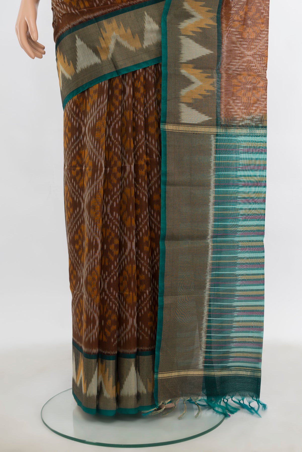 Pleats and pallu of Brown Kora Cotton Saree with Ikat Print on the body and Silk Border. 