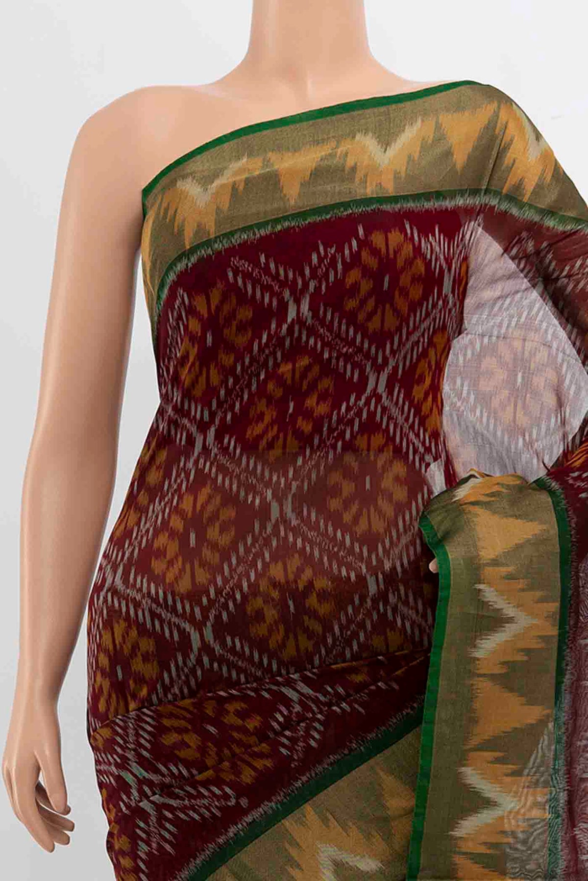 Border image of Maroon Kora Cotton Saree with Ikat Print on the body and Silk Border