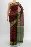 Maroon Kora Cotton Saree with Ikat Print on the body and Silk Border displayed on a mannequin