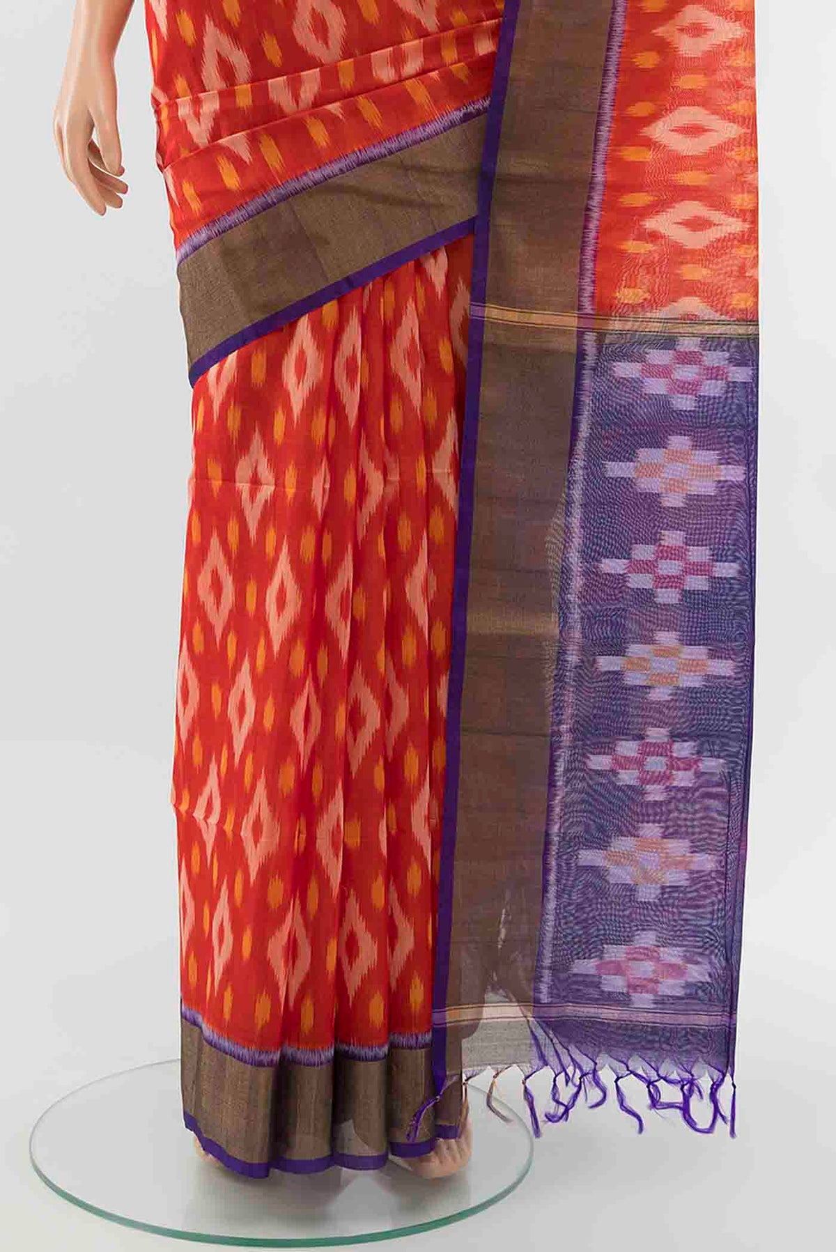 Pleats and pallu of Red Kora Cotton Saree with Ikat Print on the body and Fancy Border