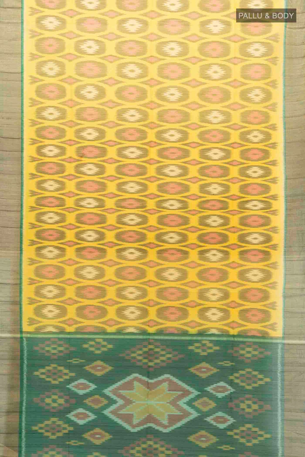 Flat view of Yellow Kora Cotton Saree with Ikat Print on the body and Silk Border