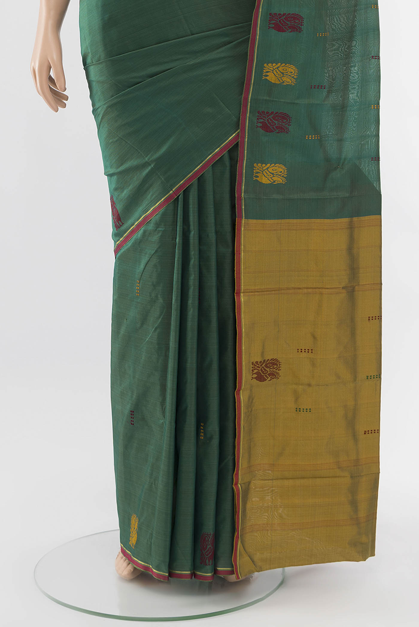 Pleats and pallu of Peacock Blue Kanchipuram Silk Saree with Zari Butta on the body and Silk Border