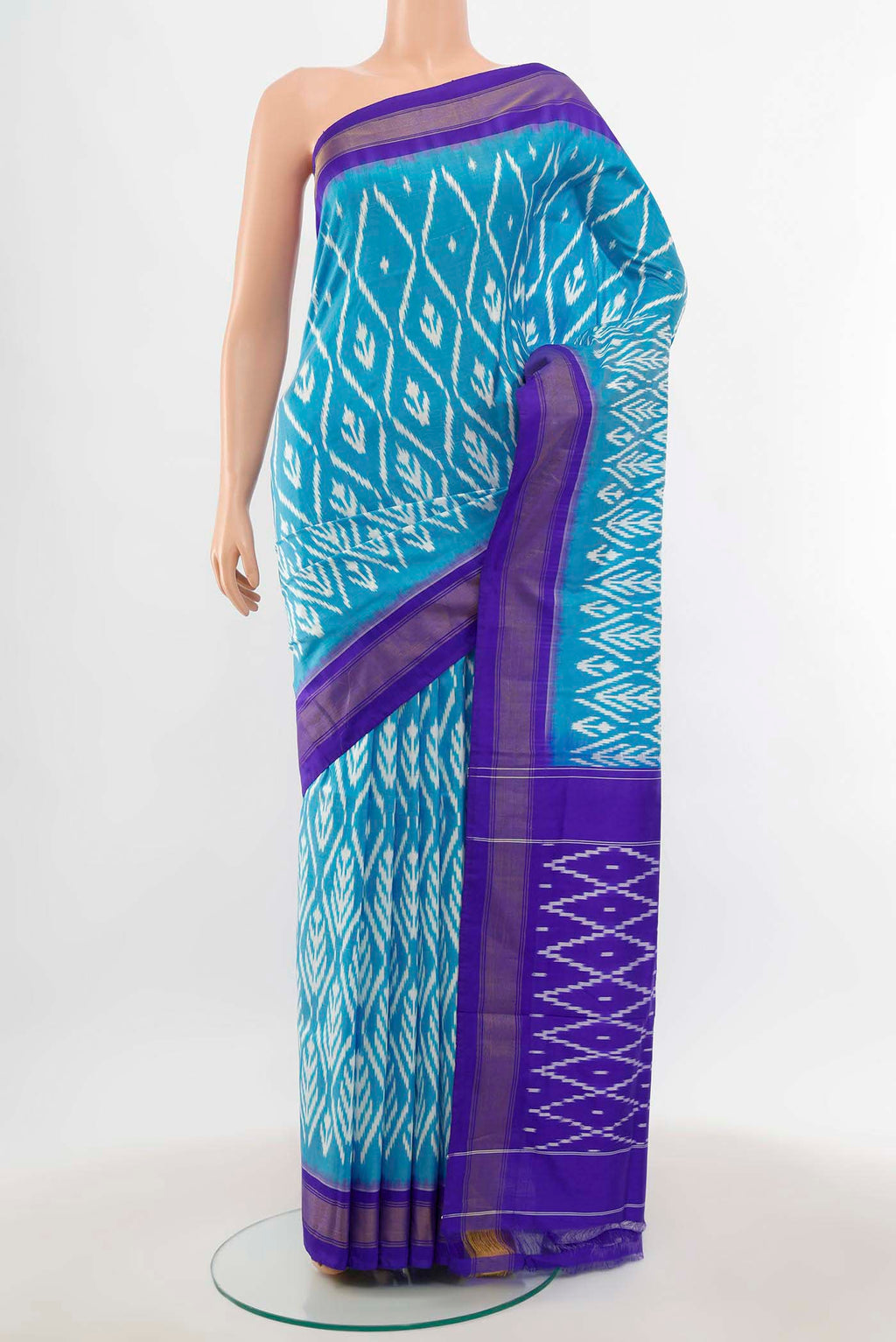 Light Blue Pochampally Saree with Zari Butta on the body and Silk Border.  displayed on a mannequin