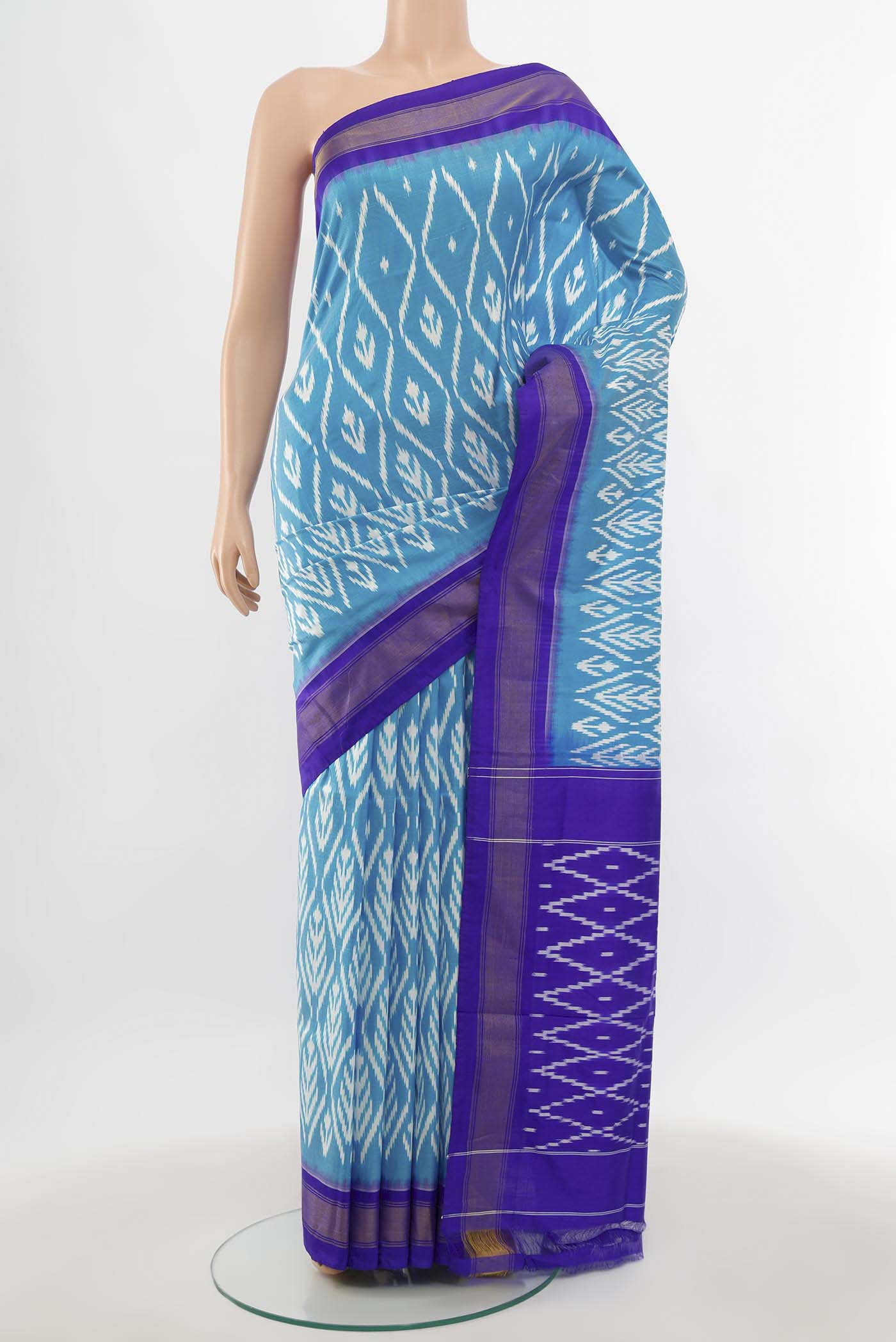 Light Blue Pochampally Saree with Zari Butta on the body and Silk Border.  displayed on a mannequin