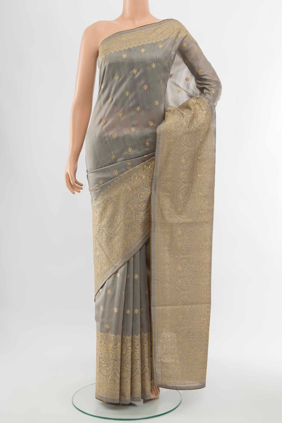 Grey Art Silk Saree with Thread Butta on the body and Silk Border displayed on a mannequin
