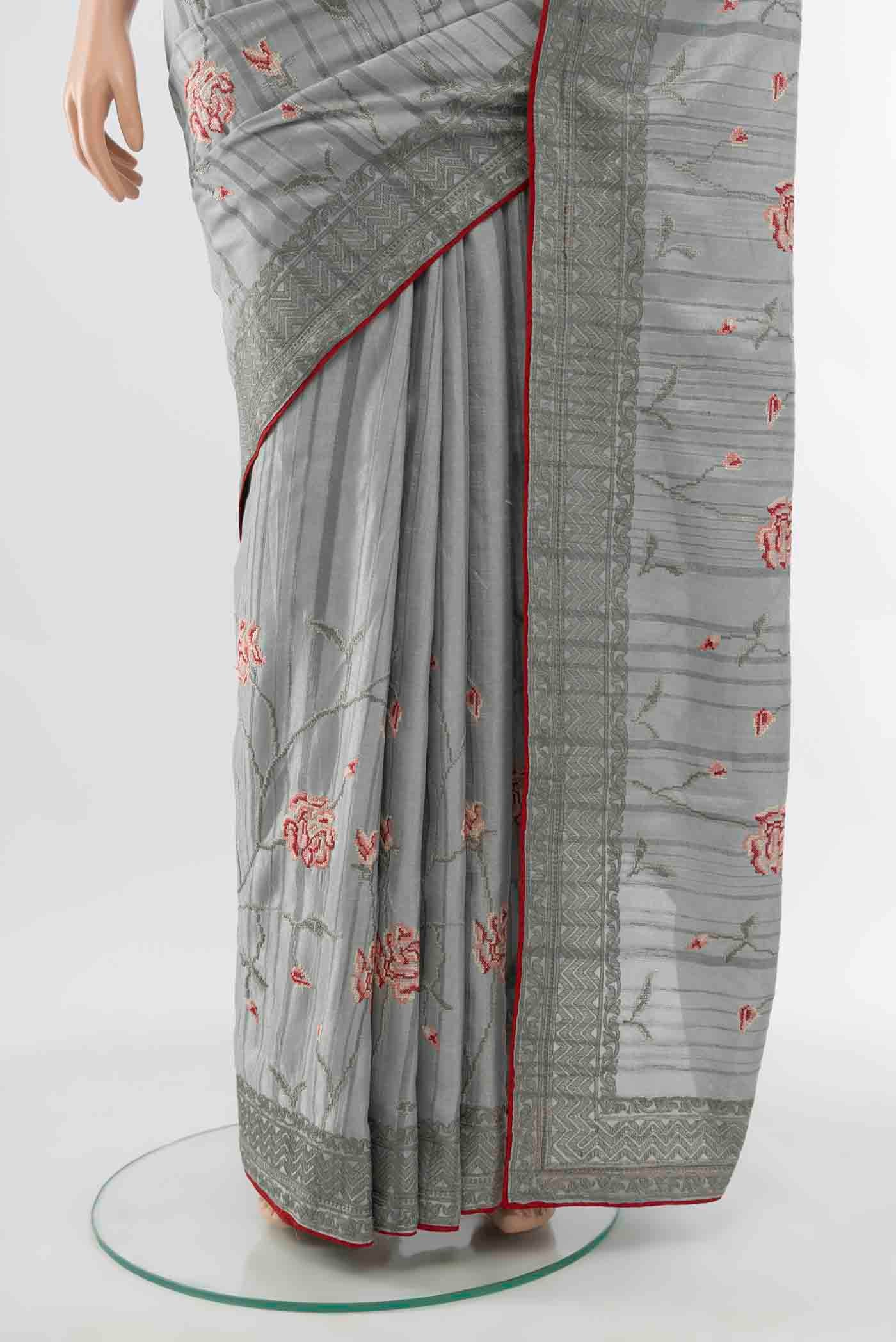 Pleats and pallu of Grey Art Silk Saree with Embroidery on the body and Silk Border
