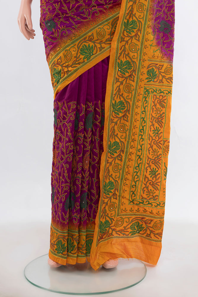 Pleats and pallu of Purple Art Silk Saree with Embroidery on the body and Silk Border. 