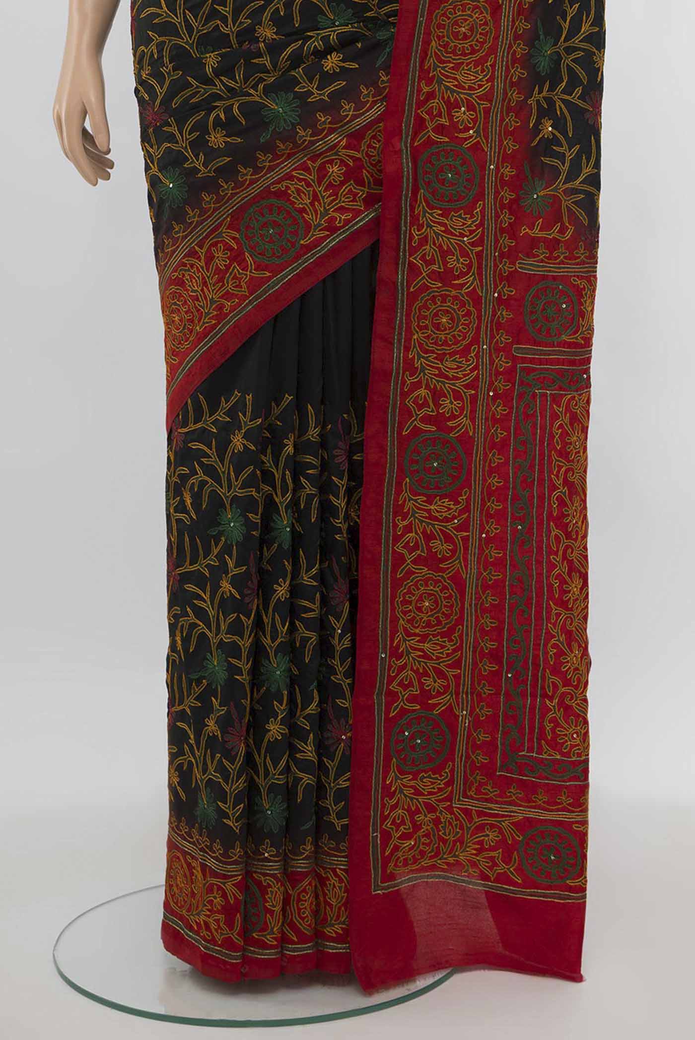 Pleats and pallu of Black Art Silk Saree with Embroidery on the body and Silk Border. 