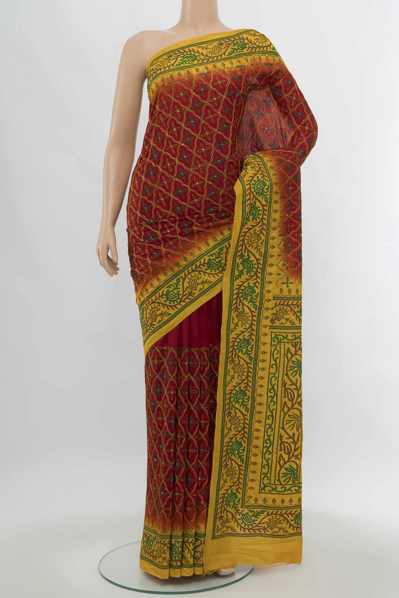 Maroon Art Silk Saree with Embroidery on the body and Silk Border.  displayed on a mannequin