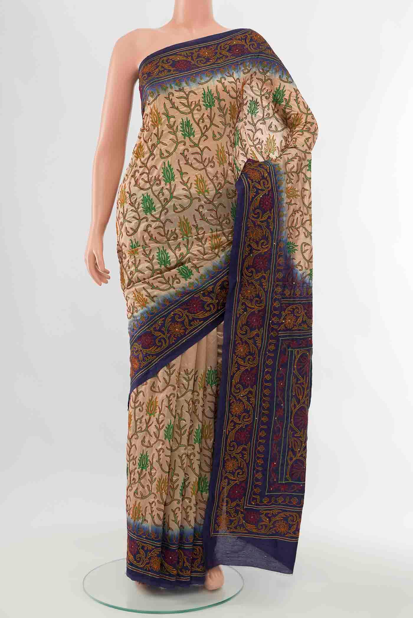 Cream Blended Raw Silk Saree with Embroidery on the body and Embroidery Border displayed on a mannequin