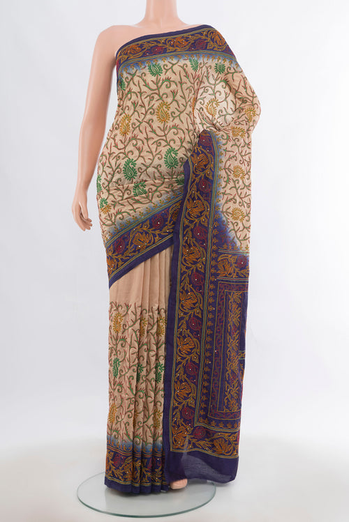 Dark Beige Art Silk Saree with Embroidery on the body and Silk Border.  displayed on a mannequin