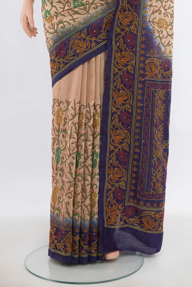 Pleats and pallu of Dark Beige Art Silk Saree with Embroidery on the body and Silk Border. 