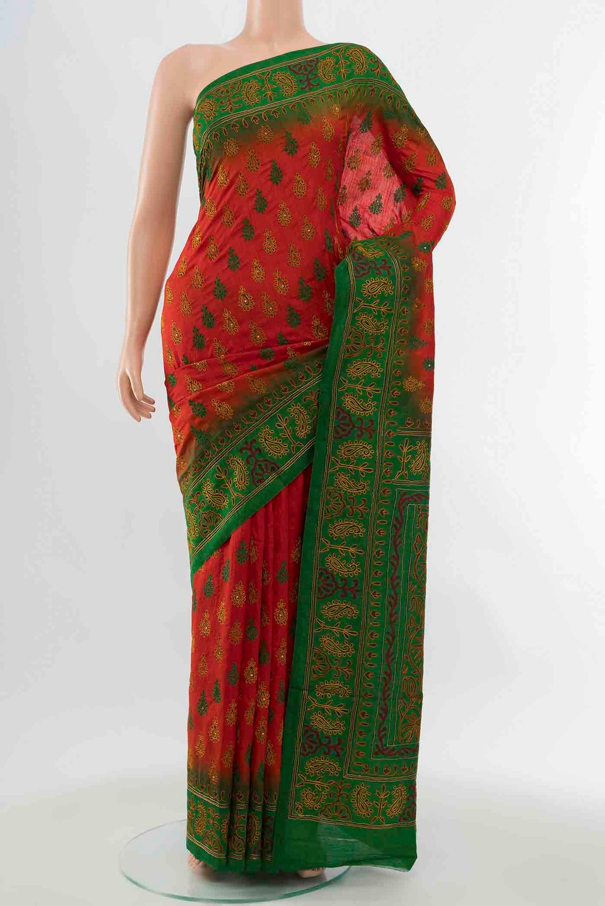Red Blended Raw Silk Saree with Embroidery on the body and Embroidery Border displayed on a mannequin