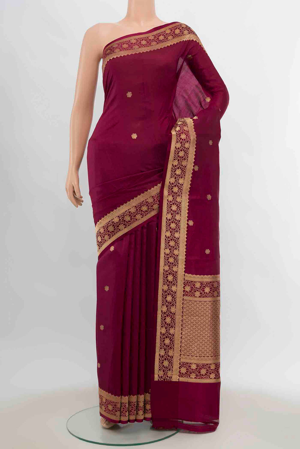 Maroon Banarasi Katan Silk Saree with Zari Butta on the body and Silk Border displayed on a mannequin
