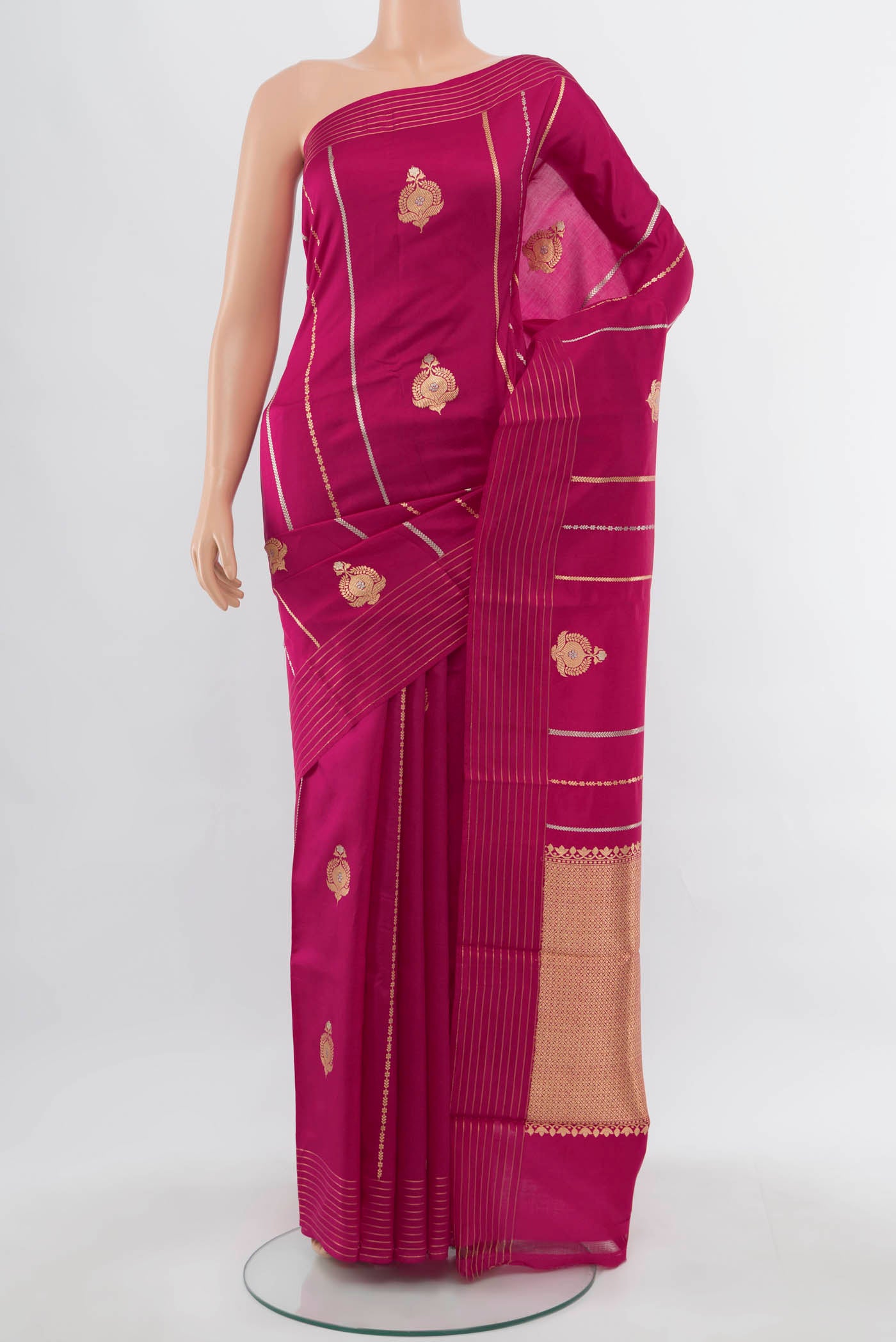 Dark Pink Banarasi Katan Silk Saree with Zari Butta on the body and Silk Border.  displayed on a mannequin