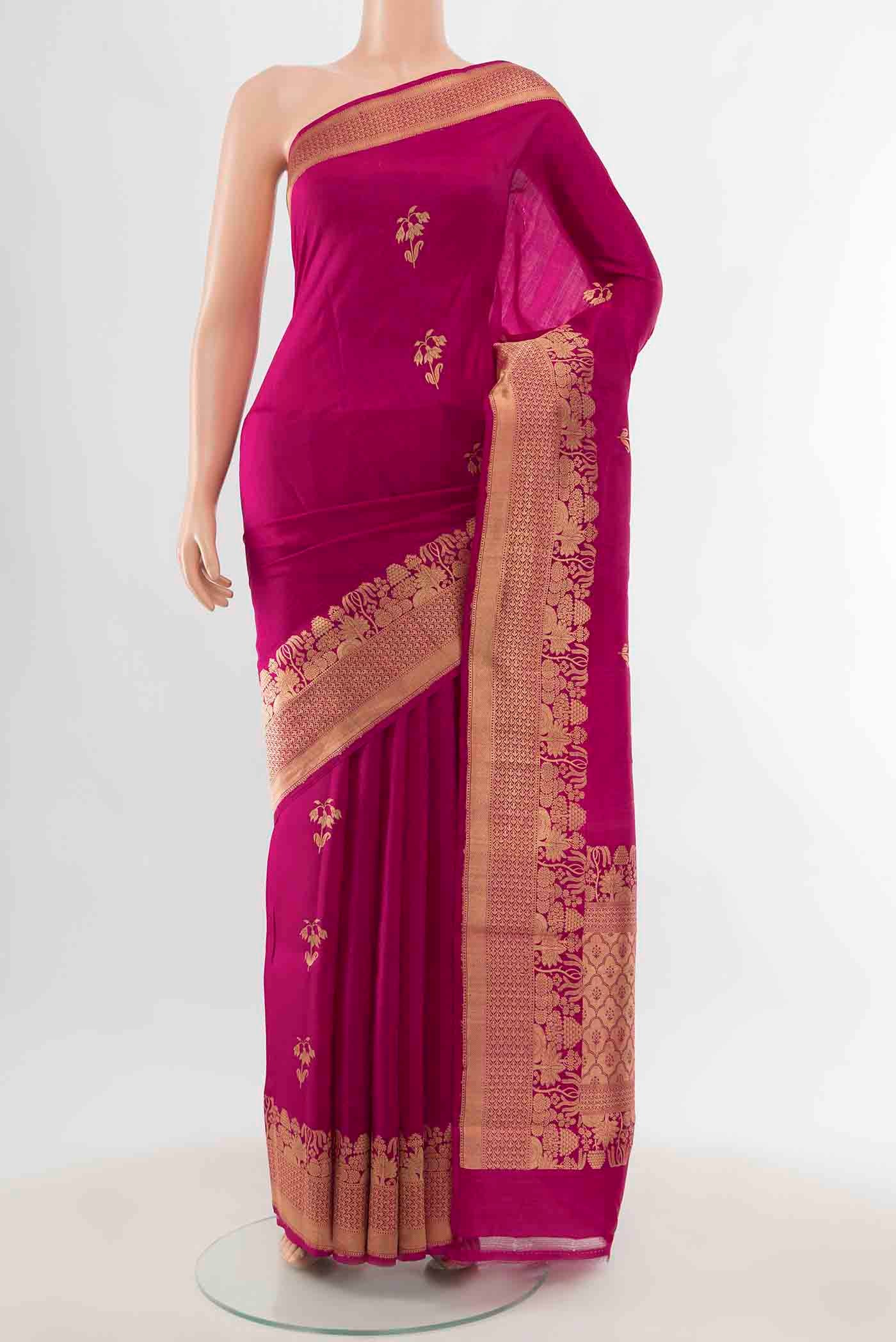 Magenta Banarasi Katan Silk Saree with Zari Butta on the body and Zari Border displayed on a mannequin
