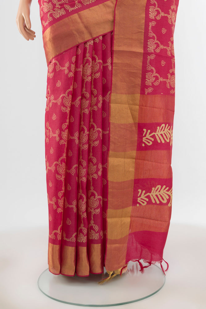 Pleats and pallu of Peach Tussar Silk Saree with Floral Print on the body and Silk Border. 