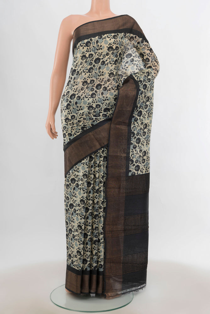 Multi Color Tussar Silk Saree with Zari Butta on the body and Silk Border.  displayed on a mannequin