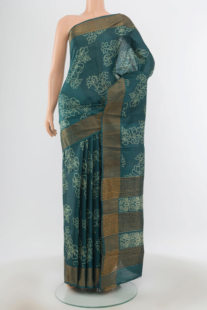 Davys Grey Tussar Silk Saree with Floral Print on the body and Silk Border.  displayed on a mannequin