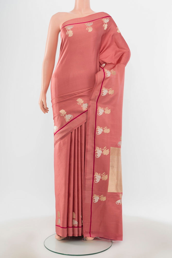 Pure Silk Pure Zari Bronze Banarasi Katan Saree with Zari Butta on the body and Silk Border.  displayed on a mannequin