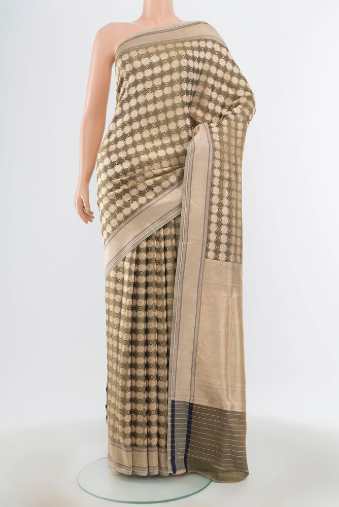 Olive Green Banarasi Silk Saree with Zari Butta on the body and Silk Border.  displayed on a mannequin