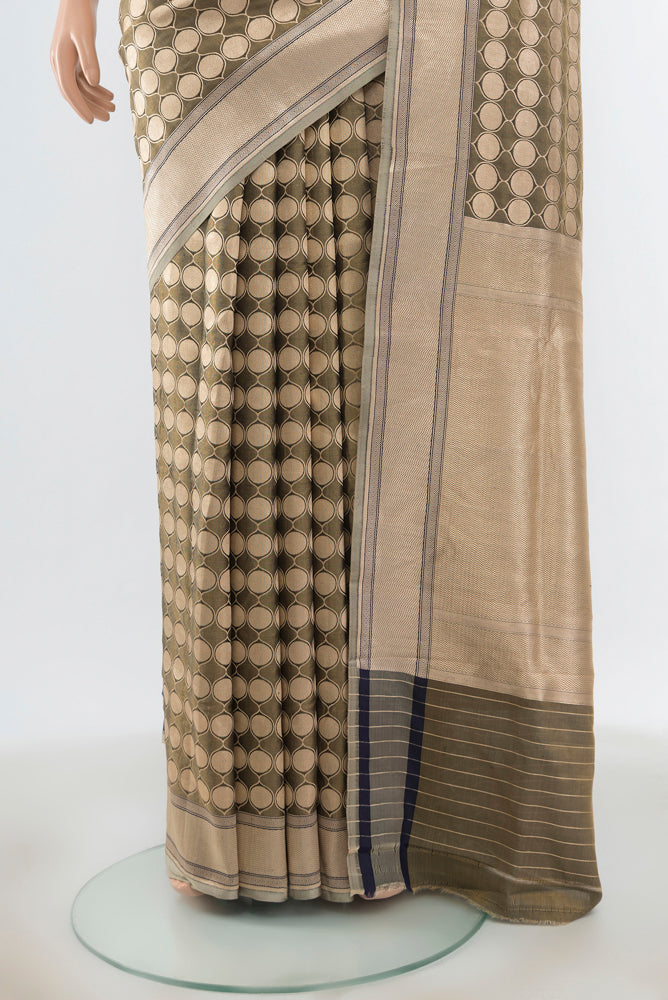Pleats and pallu of Olive Green Banarasi Silk Saree with Zari Butta on the body and Silk Border. 