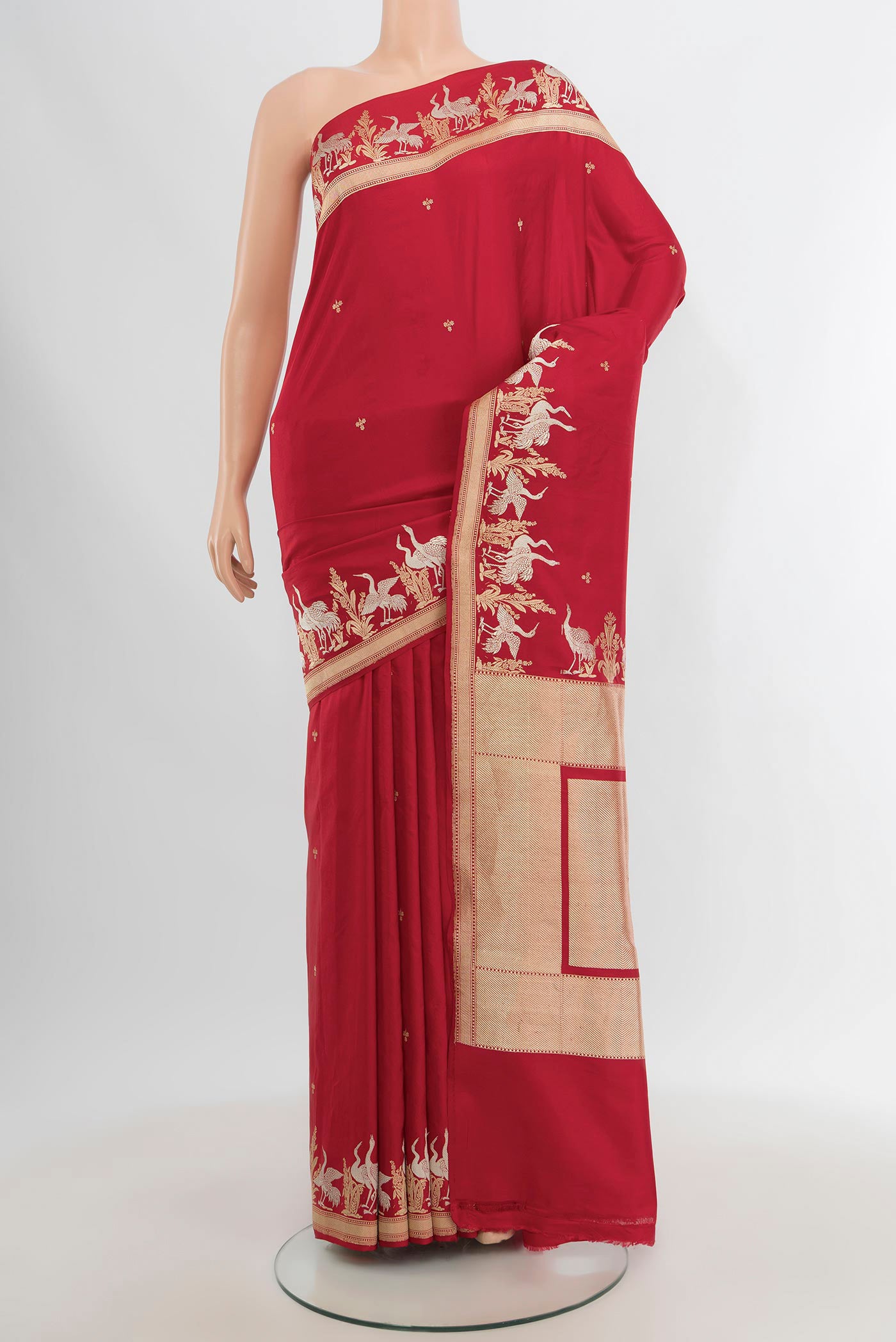 Red Banarasi Silk Saree with Zari Butta on the body and Zari Border.  displayed on a mannequin