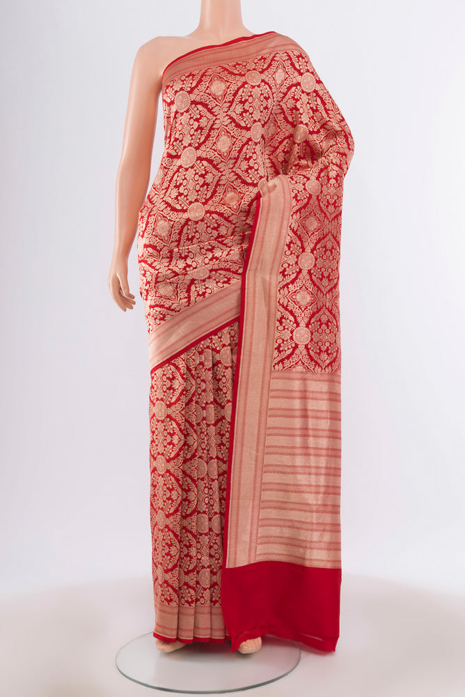 Red Banarasi Silk Saree with Zari Butta on the body and Silk Border.  displayed on a mannequin