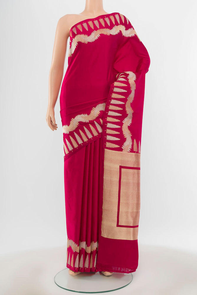 Pure Silk Pure Zari Dark Pink Banarasi Katan Saree with Zari Butta on the body and Silk Border.  displayed on a mannequin
