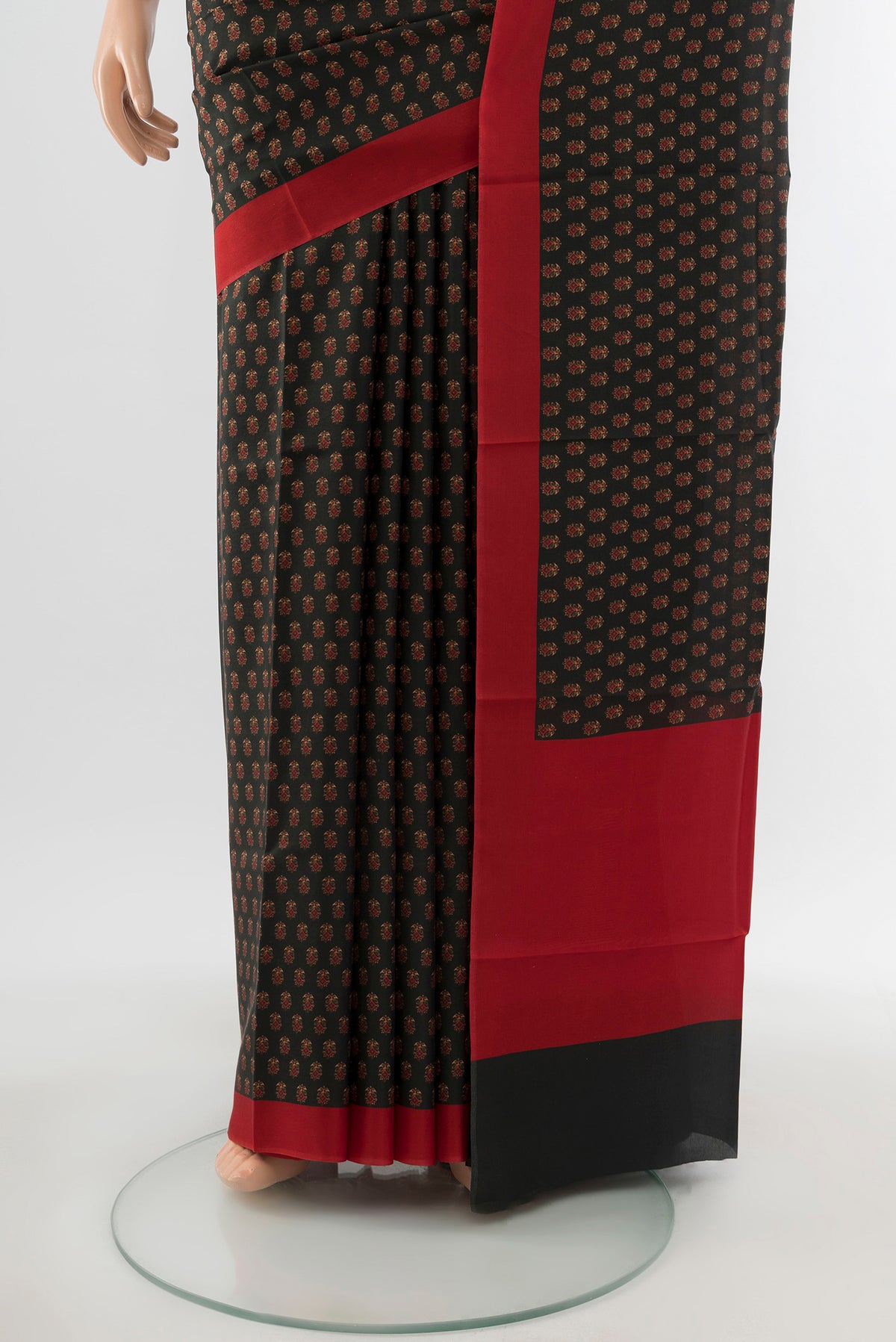 Pleats and pallu of Black Printed Silk Saree with Floral Print on the body and Printed Border. 
