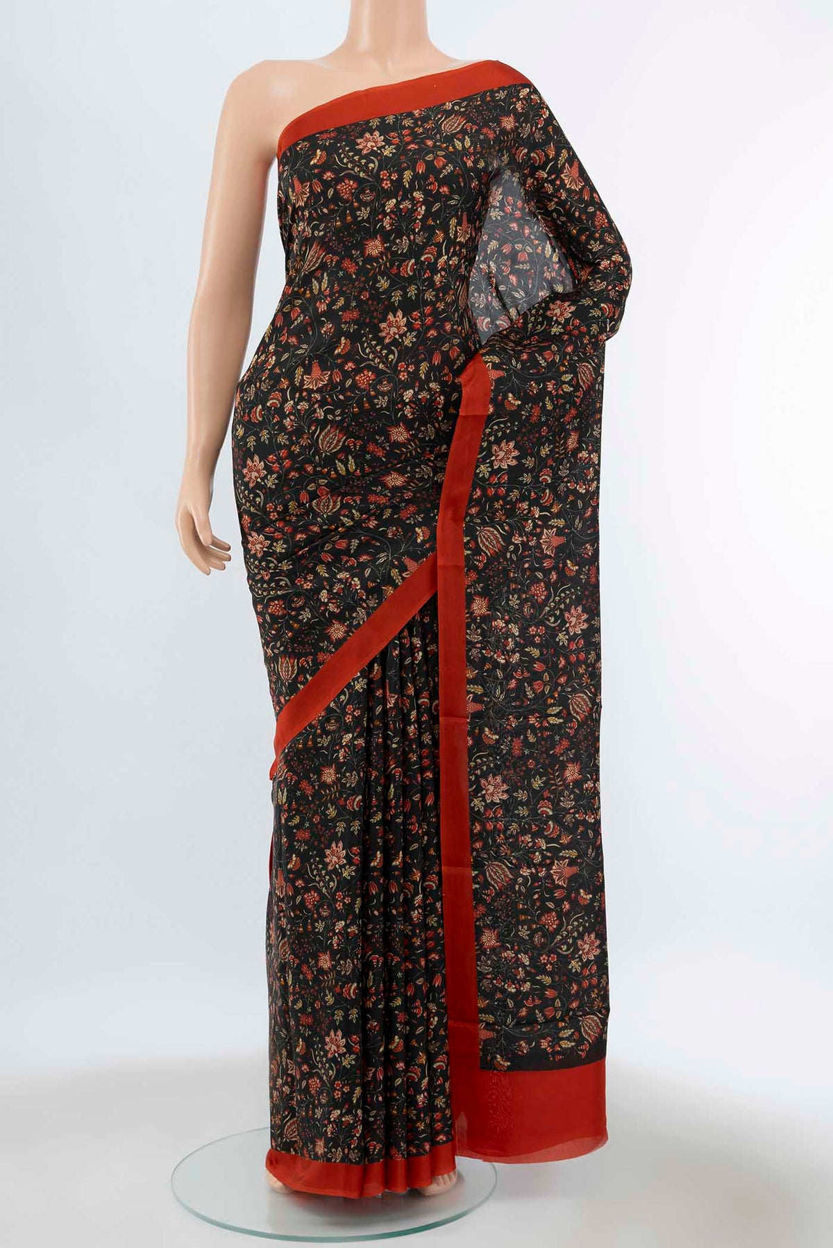 Pure Silk Pure Zari Black Printed Saree with Floral Print on the body and Fancy Border displayed on a mannequin