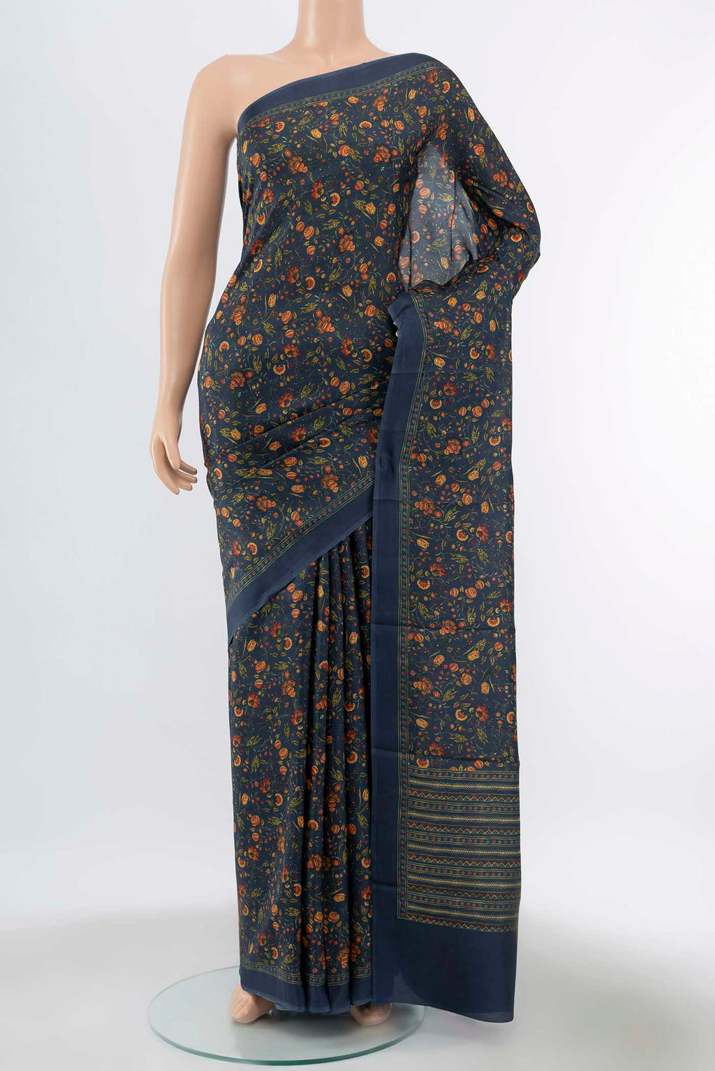 Pure Silk Pure Zari Indigo Printed Saree with Floral Print on the body and Fancy Border displayed on a mannequin