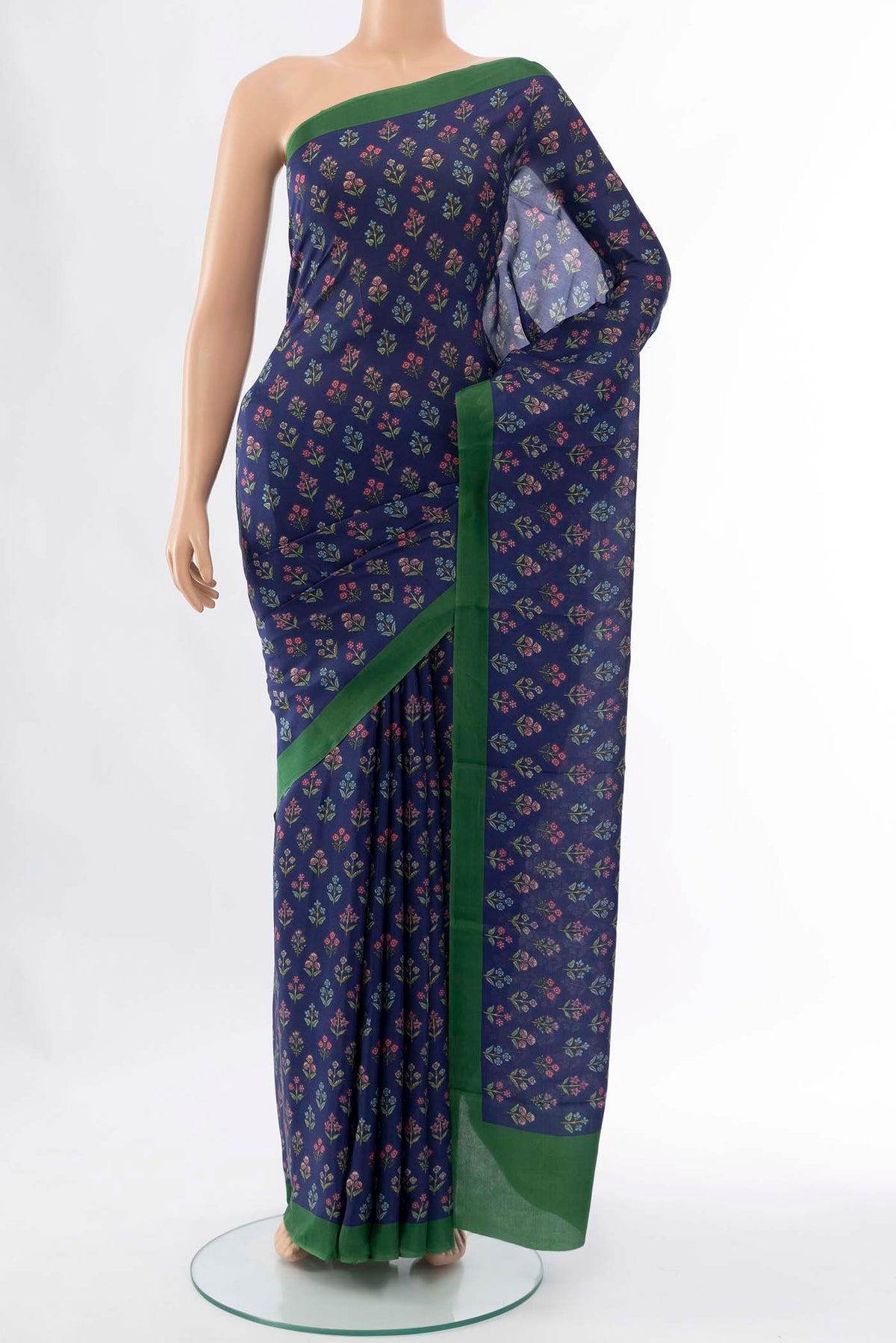 Navy Blue Printed Silk Saree with Floral Print on the body and Attached Border displayed on a mannequin