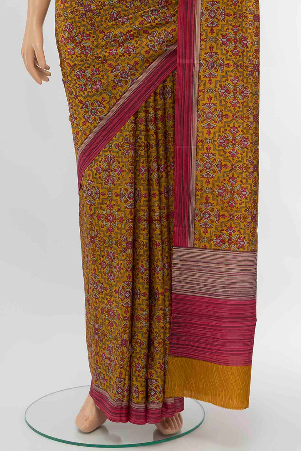 Pleats and pallu of Rust Printed Silk Saree with Floral Print on the body and Silk Border