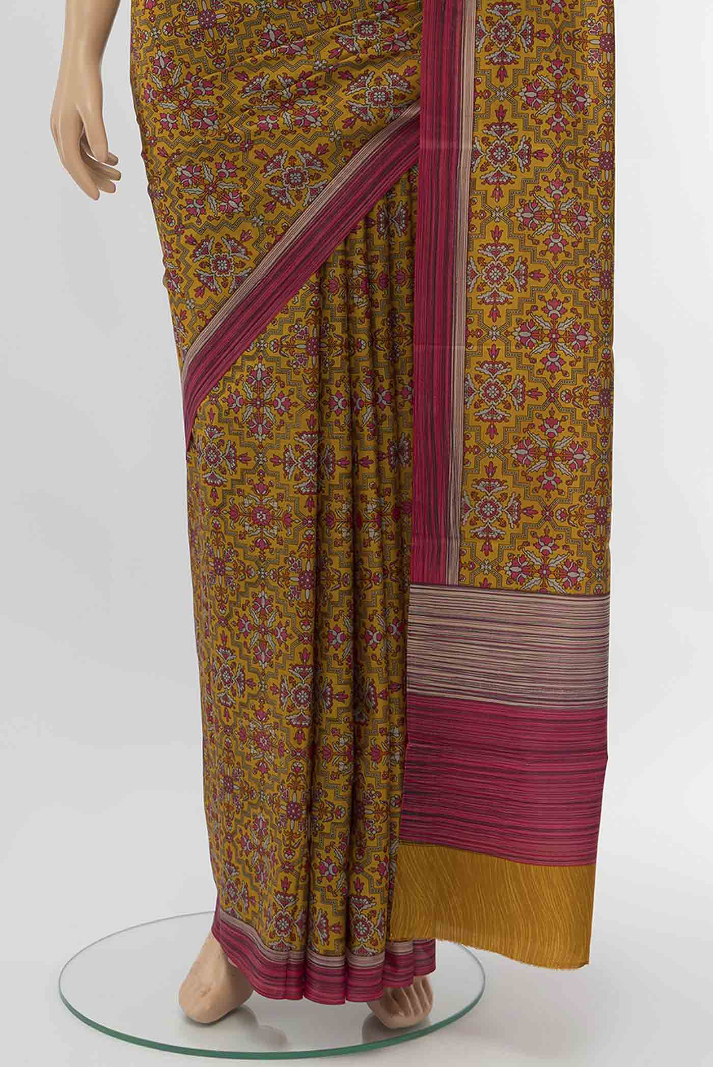 Pleats and pallu of Rust Printed Silk Saree with Floral Print on the body and Silk Border