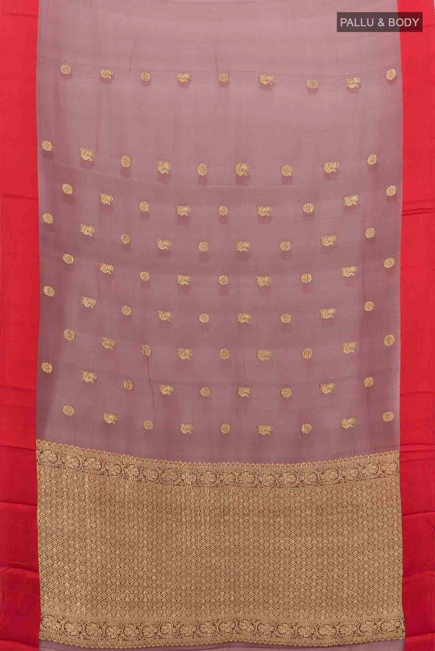Flat view of Maroon Chiffon Saree with Zari Butta on the body and Silk Border
