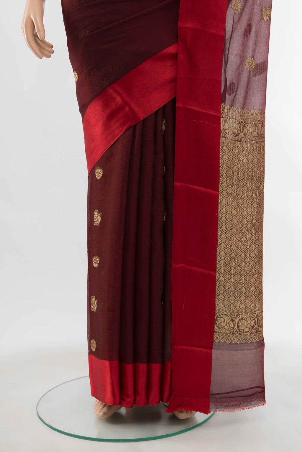 Pleats and pallu of Maroon Chiffon Saree with Zari Butta on the body and Silk Border