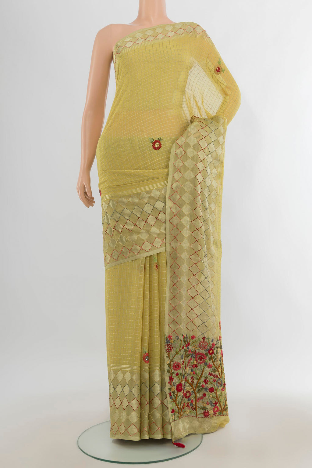 Light Green Georgette Saree with Zari Butta on the body and Silk Border.  displayed on a mannequin