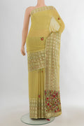 Light Green Georgette Saree with Zari Butta on the body and Silk Border.  displayed on a mannequin