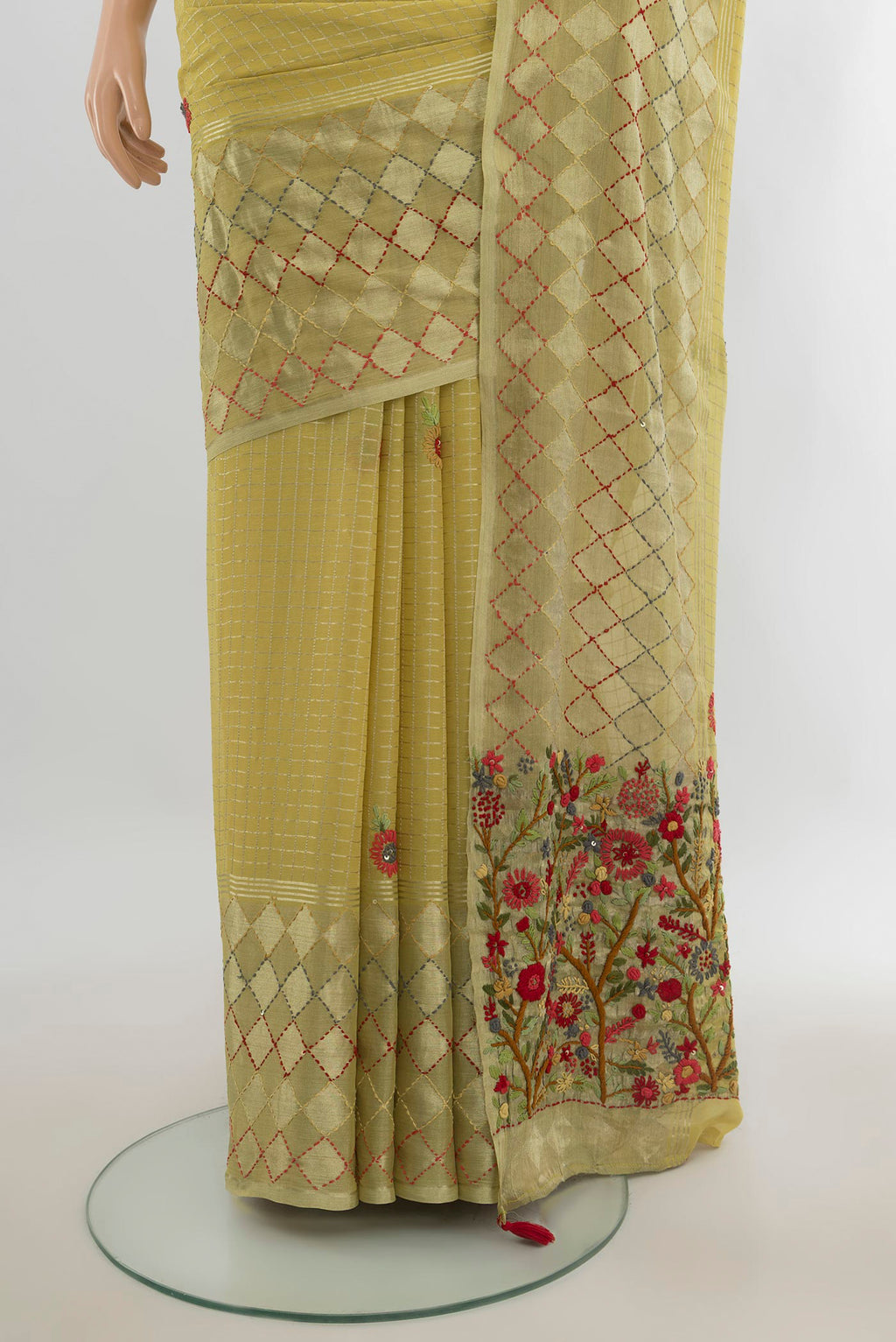 Pleats and pallu of Light Green Georgette Saree with Zari Butta on the body and Silk Border. 