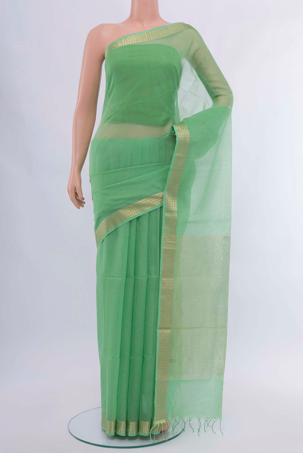 Light Green Maheshwari Silk Cotton Saree with Zari Butta on the body and Silk Border displayed on a mannequin