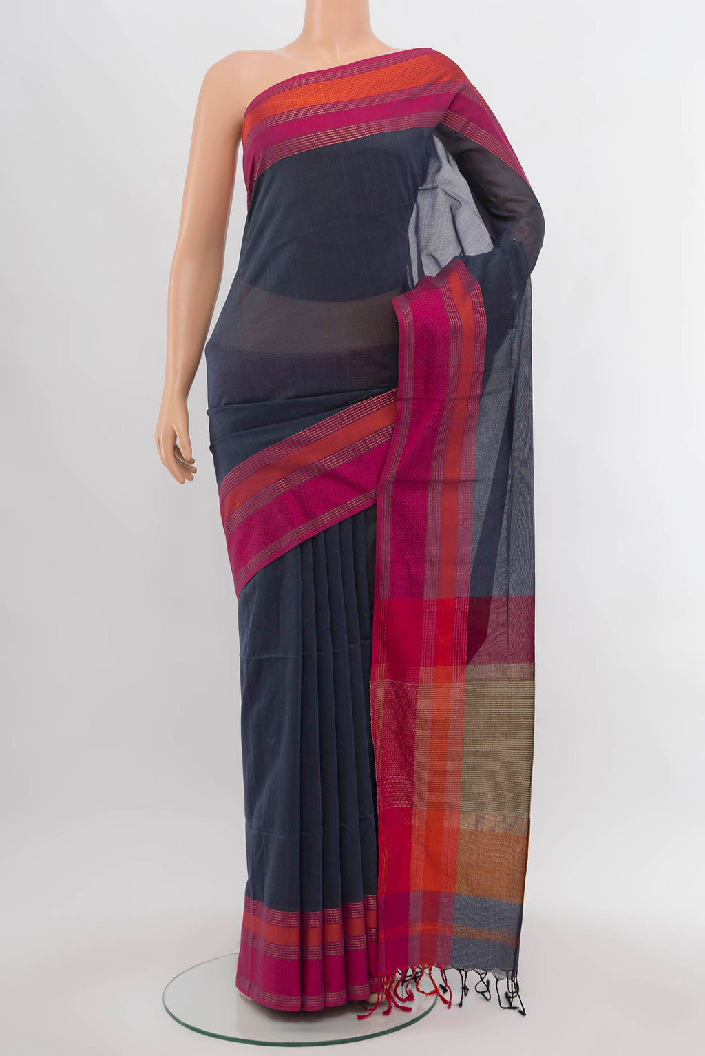 Grey Maheshwari Silk Cotton Saree with Zari Butta on the body and Silk Border.  displayed on a mannequin