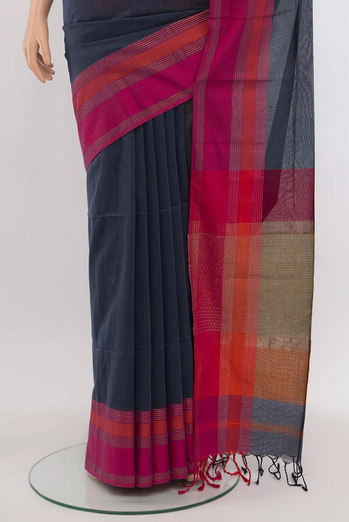 Pleats and pallu of Grey Maheshwari Silk Cotton Saree with Zari Butta on the body and Silk Border. 
