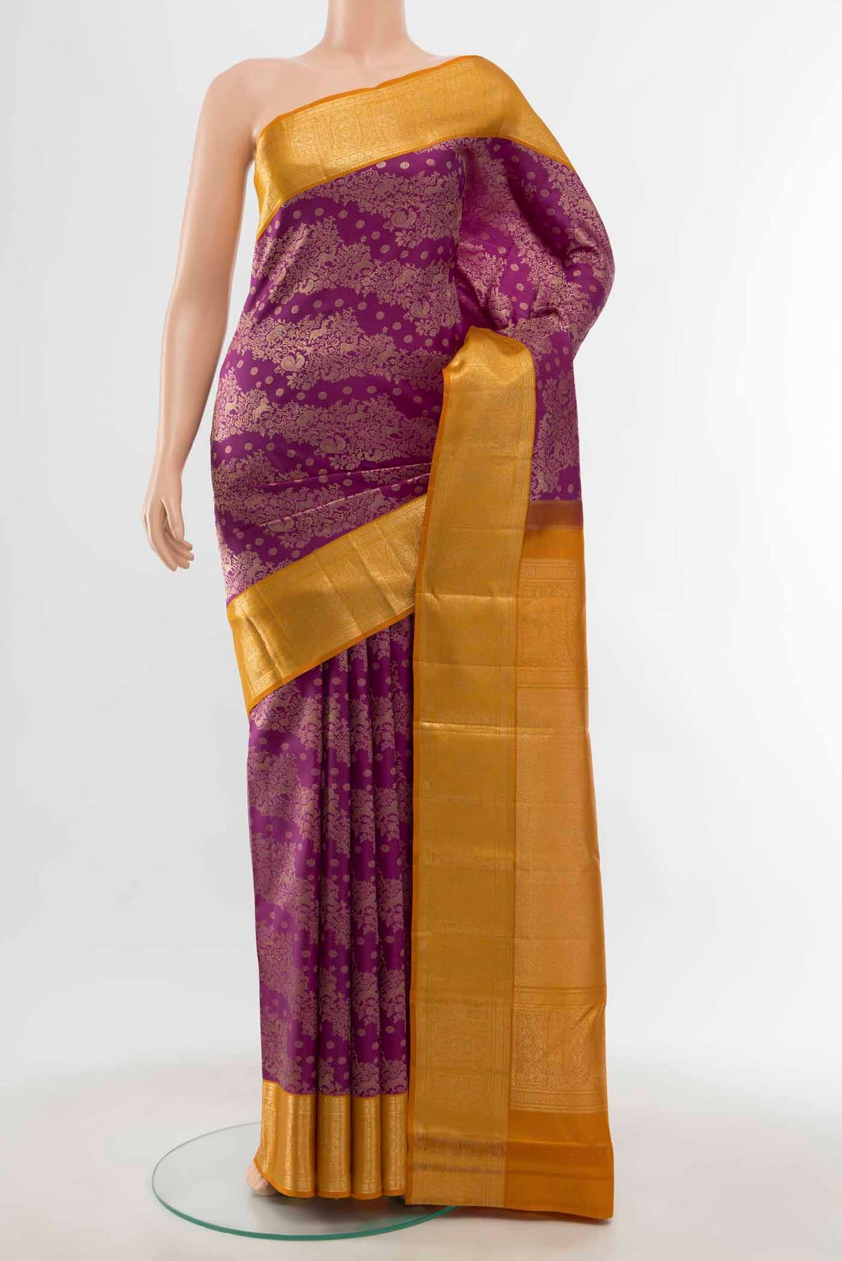 Magenta Kanchipuram Silk Saree with Zari Butta on the body and Silk Border displayed on a mannequin