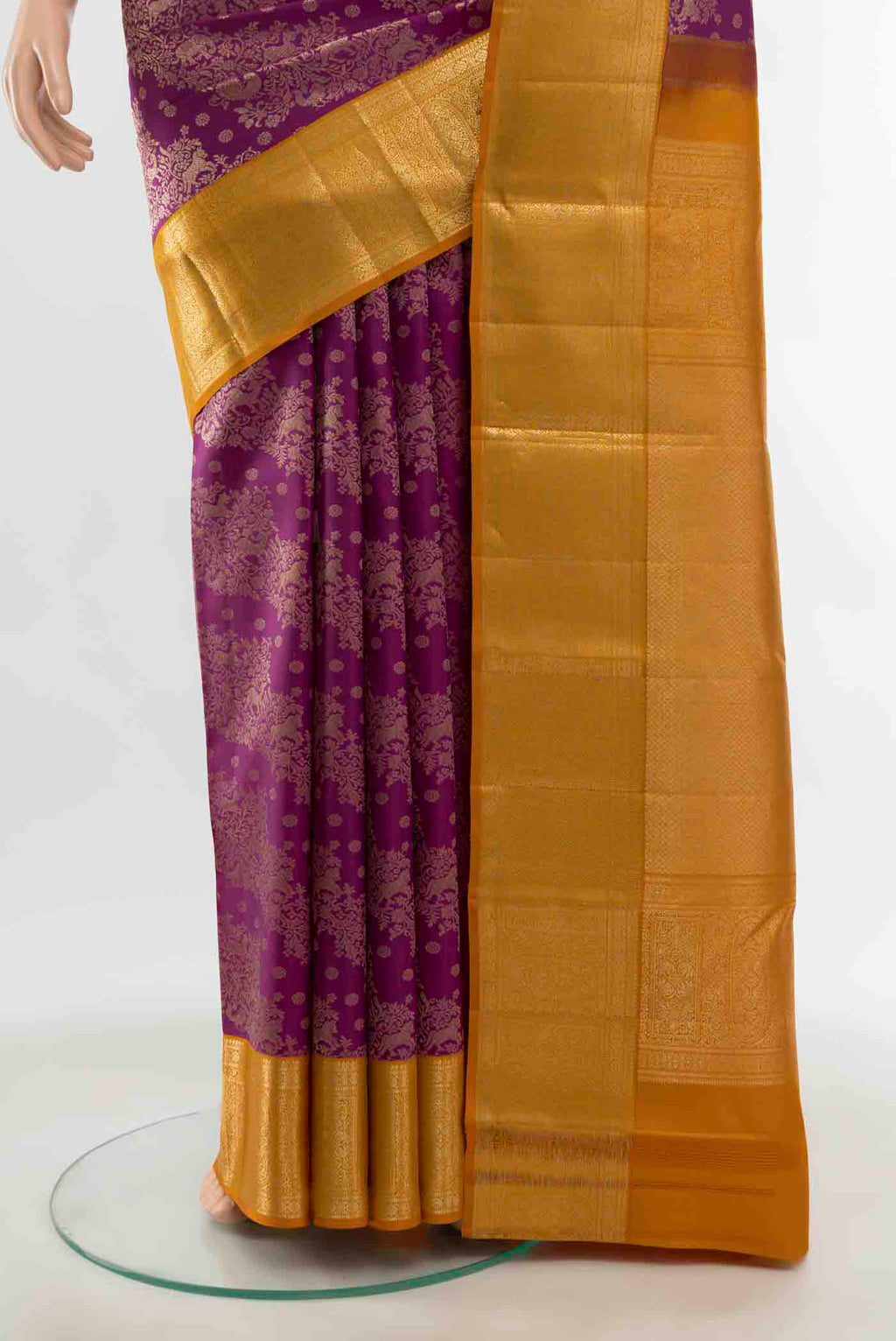 Pleats and pallu of Magenta Kanchipuram Silk Saree with Zari Butta on the body and Silk Border