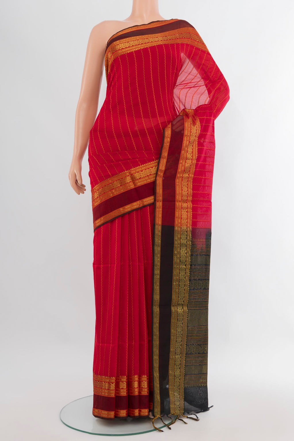 Red Silk Cotton Saree with Stripes on the body and Zari Border.  displayed on a mannequin
