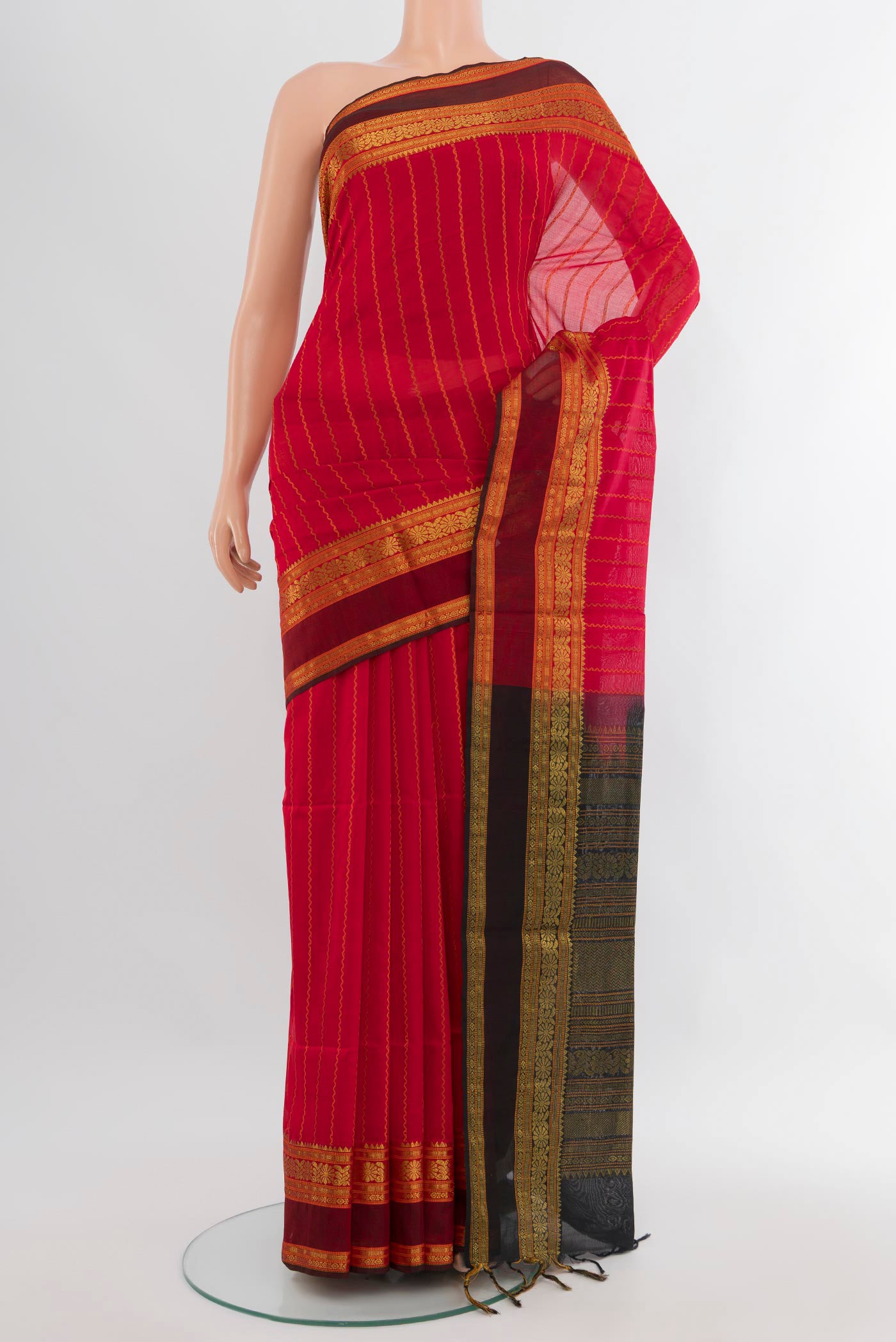 Red Silk Cotton Saree with Stripes on the body and Zari Border.  displayed on a mannequin
