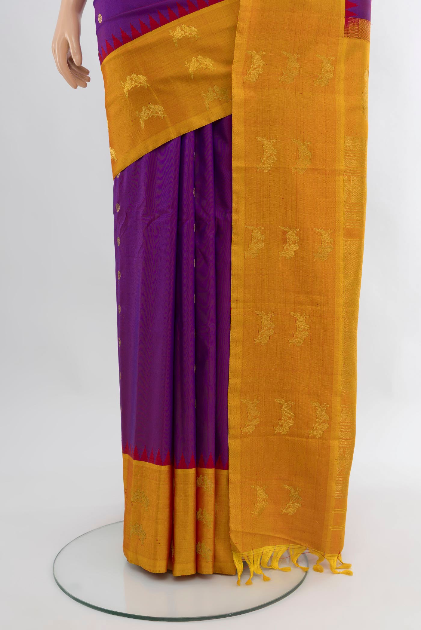 Pleats and pallu of Purple Gadwal Silk Saree with Zari Butta on the body and Zari Border. 